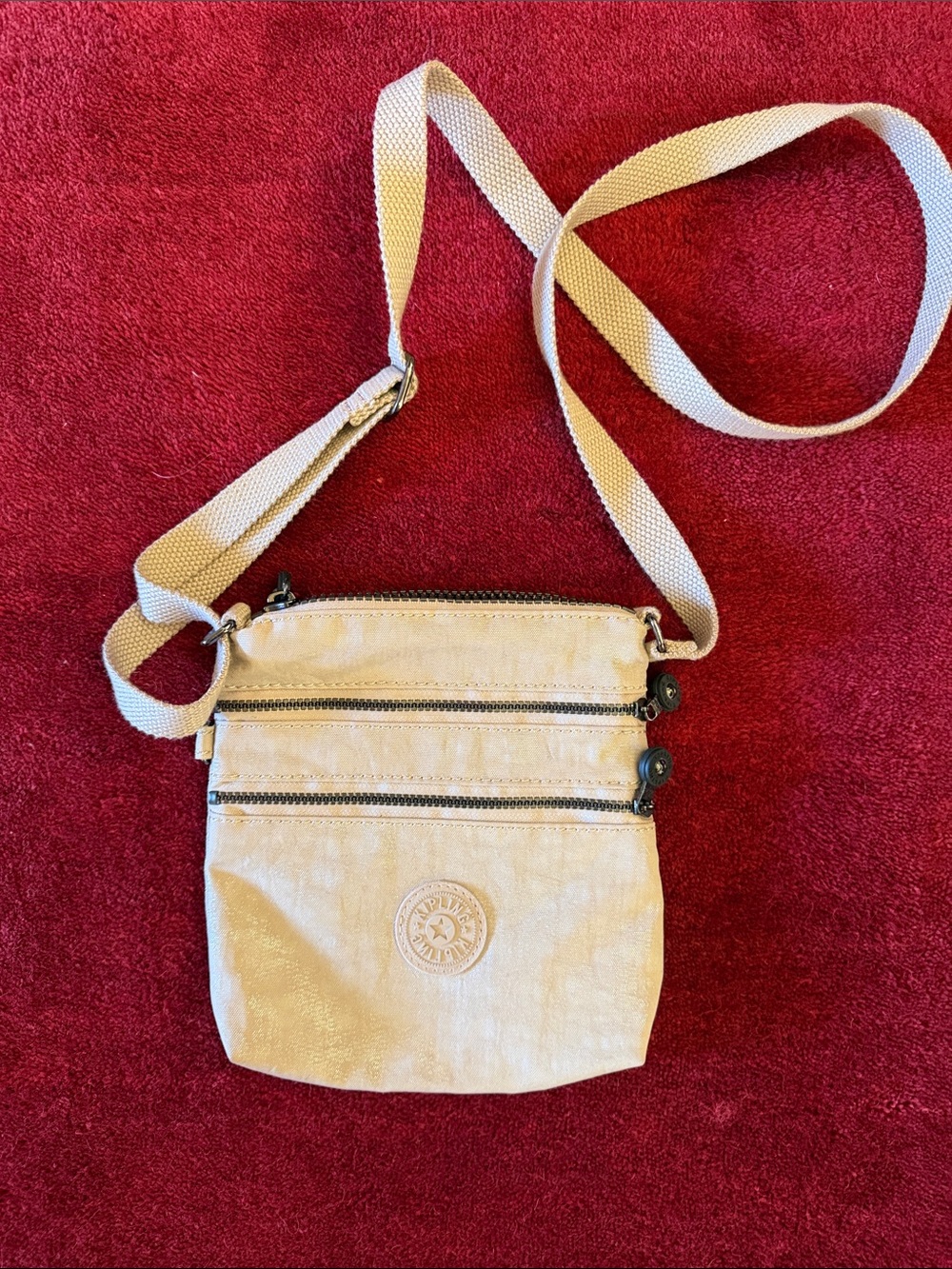 Kipling Beige Crossbody with Triple Zip Front Pockets. Excellent condition